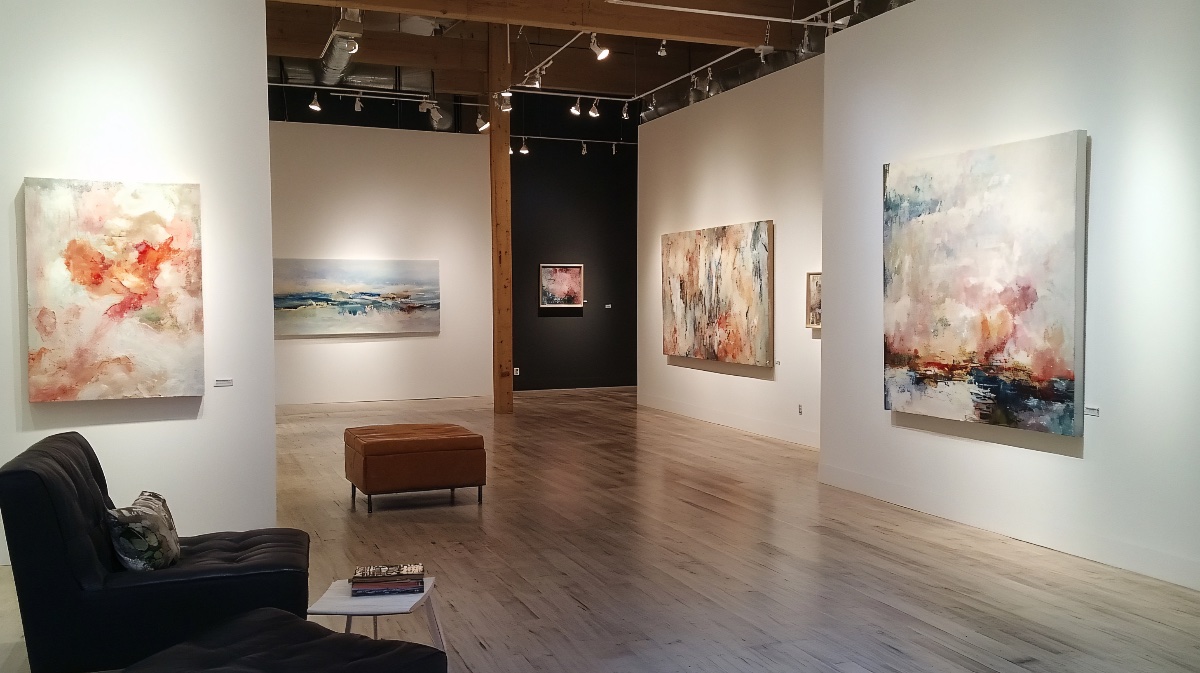 art-gallery-featuring-peach-fuzz-abstract-paintings-white-walls